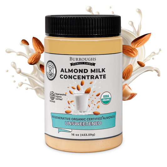 Burroughs Family Farms Regenerative Organic Almond Milk Concentrate jar with almond milk splash