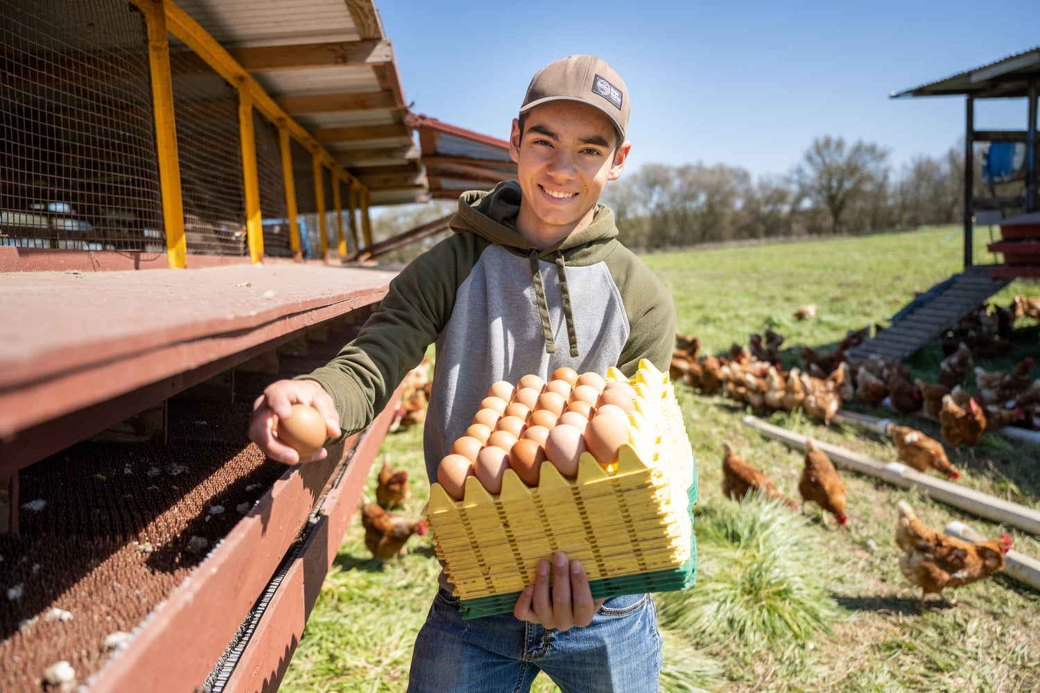 Photo of a young man holding eggs