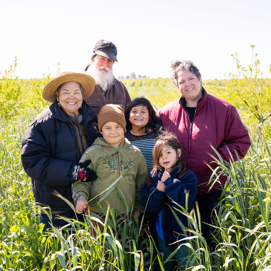 The Burroughs Family in a field on their farm