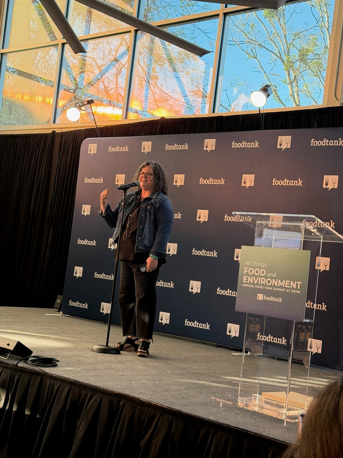 Benina Montes speaking on stage at the Food Tank Summit at SXSW
