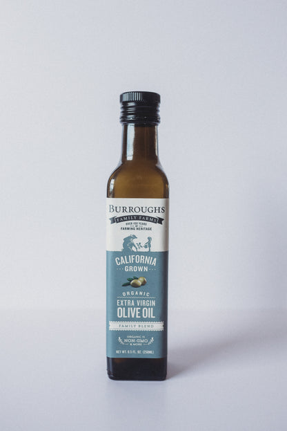 Bottle of Burroughs Family Farms organic extra virgin olive oil on a plain background